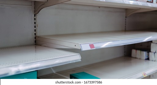 Panic Buying And Food Shortage Supply Crisis Concept.Empty Shelves In Supermarket Store Panic.Food Shelf Has Been Wiped Out From Panic Buyer.supply Chain.inflation Money.Palm Oil Indonesia.grocery.