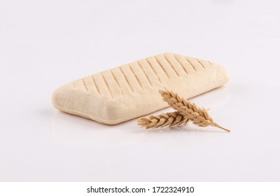 panini bread toasted with ears wheat low angle on white background