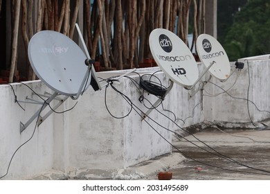 Panki, Uttar Pradesh India- August 25 2021: Parabolic antenna of the D2H direct satellite television. Cable tv connection box for household distribution.