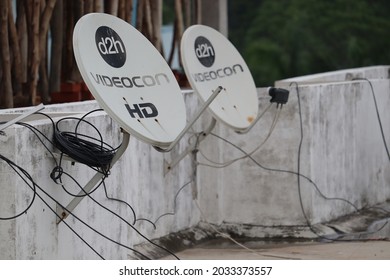 Panki, Uttar Pradesh India- August 25 2021: Parabolic antenna of the direct to home satellite television. Cable tv connection network for household distribution.