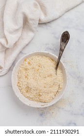 Panko Japanese Crispy Breadcrumbs In A White Plate On A Marble Background Close-up. A Crumb For Cooking . Selective Focus, Top View