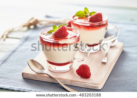 Panna cotta with rasperry and mint  topping with strawberry sauce