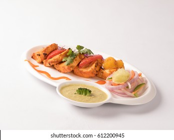 Panner Tikka Served In Dip Plate On White Background