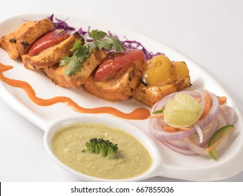 Panner Tikka Served In Dip Plate On White Background