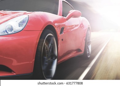 Panning shot of a beautiful red sports car speeding on a highway with motion blur