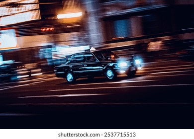 A panning shot of a black taxi speeding through city streets at night, creating a blurred motion effect with neon lights in the background. - Powered by Shutterstock