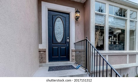 Pano Front View Of A House With Stairs Going Up To Front Door With Oval Glass Pane