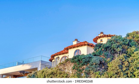 Pano House With Beautifully Landscaped Yard Against Blue Sky In San Diego California. Scenic Coastal Residential View With Beautiful Homes And Lush Plants.