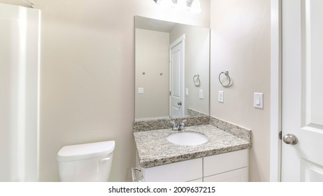 Pano Small White Bathroom Interior With Ambient Lightnings And Closed White Door