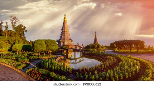 Panolama landscape of two pagoda in Doi Inthanon Mountain with evening orange light splashed at the pagoda in sunset, Chaingmai, Thailand