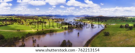 Panorama above Murray river flowing through Hume Lake in regional rural NSW surrounded by green cultivated agricultural fiels of farms. Stock foto © 