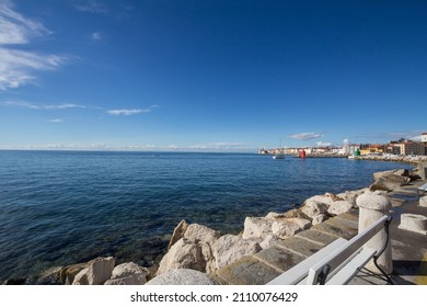Panorama of the Adriatic sea, with blue water and sky, on a wharf and quay in Piran, slovenia, during a sunny summer afternoon. Piran, or Pirano, is a slovenian city on the adriatic sea in istria.