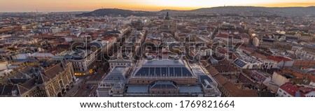 Panorama aerial drone shot of east facade of St. Stephen's Basilica in Budapest sunrise morning glow in winter