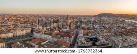 Panorama Aerial drone shot of St. Stephen Basilica during Budapest sunset hour in winter time
