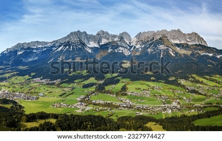 Panorama aerial image of valleys and the famous Wilder Kaiser mountain range, Kitzbuehel, Tyrol, Austria