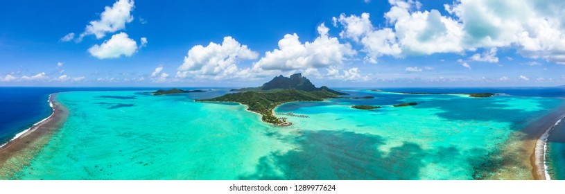 Panorama aerial view of Bora Bora island, Tahiti, French Polynesia, Matira point with overwater bungalows of a luxury resort and Mount Otemanu with amazing turquoise lagoon. Holiday dream. Paradise