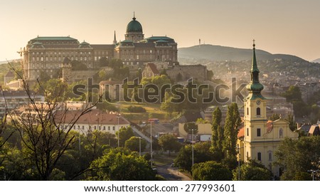 Panorama Aerial View Buda side of Budapest over Buda Castle, St. Matthias Church and Fishermen's Bastion and adjacent area of Danube river under Golden Sky Sunset in Summer in Budapest, Hungary.