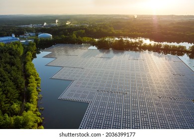 Panorama aerial view of lake in floating solar panels cell platform on renewable alternative electricity