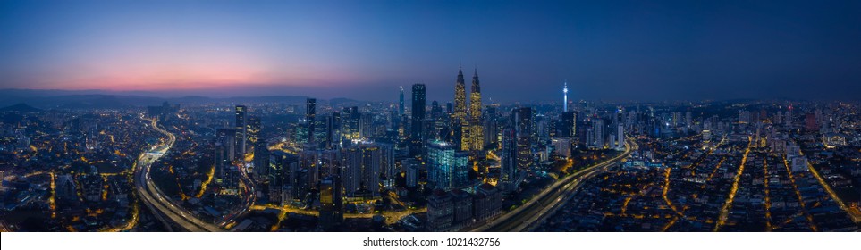 Panorama Aerial View In The Middle Of Kuala Lumpur Cityscape Skyline .Night Scene Before Sunrise , Malaysia .