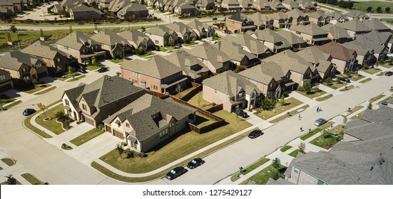 Panorama aerial view new development community with row of detached single-family house and garden. Flyover residential area suburban Dallas, Texas, USA