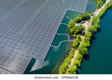 Panorama aerial view of renewable alternative electricity energy the floating solar panels cell platform on the beautiful lake