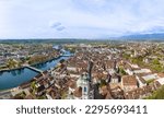 Panorama of aerial views of the old town of Solothurn city with St. Ursus Cathedral - a Swiss heritage site of national significance - at the foreground and the Aare River on the left. 