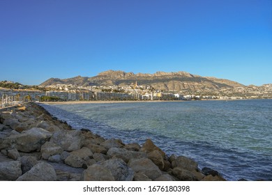 Panorama of Altea from the sea with rocks and Sierra Bernia mountain