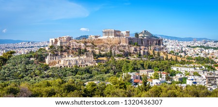 Panorama of Athens and Acropolis hill, Greece. Old Acropolis is famous landmark of Athens. Ancient Greek ruins in Athens center, panoramic view of remains of antique Athens city. World Heritage site.