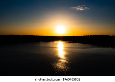 Panorama Of Autumn River Landscape In Belarus Or European Part Of Russia At Sunset. Sun Shine Over Blue Water Lake Or River At Sunrise. Nature At Sunny Morning. Woods With Orange Foliage On Riverside