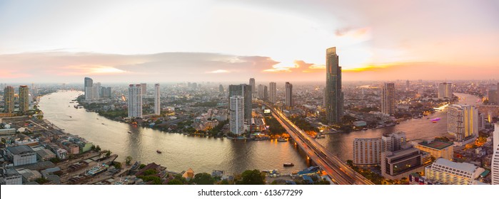 Panorama Bangkok city with the chaophraya river at sunset
