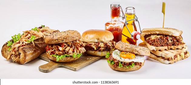 Panorama Banner With Delicious Takeaway Food Including A Pulled Chicken Burger And Baguette, Sloppy Joe Sandwich, Egg Burger And Bagel Over A White Background For Advertising