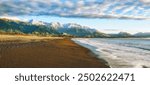 panorama of a beautiful black sand beach in north canterbury near kaikoura; new zealand south island