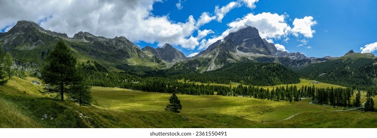 Panorama of a beautiful mountain valley. Mountain panoramic landscape. Beautiful mountain panorama. Mountain panorama in Alps - Powered by Shutterstock