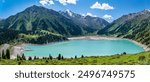 Panorama of Big Almaty Lake in the mountains in summer. Beautiful high-mountain lake not far from Almaty.