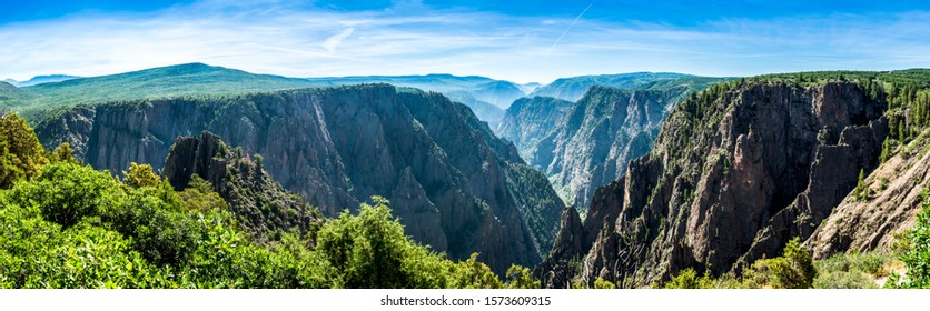 panorama of the black canyon of the gunnison national park in summer on a sunny day with blue sky