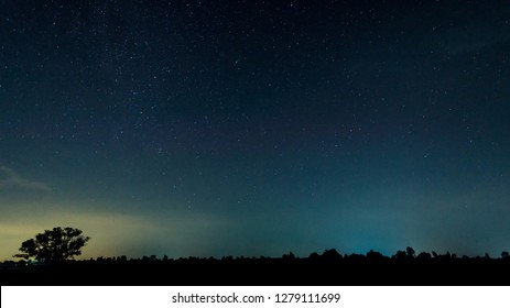 Panorama blue night sky milky way and star on dark background.Universe filled with stars, nebula and galaxy with noise and grain.Photo by long exposure and select white balance.Dark night sky. - Shutterstock ID 1279111699