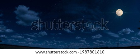 Panorama of blue sky with white fluffy clouds