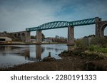 Panorama of Boyne viaduct in drogheda spanning over river Boyne in early evening hours. Beautiful pucture of a green metal viaduct and stone arches.