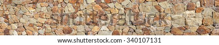 Panorama of Brown Stone Wall Background and Texture Photo