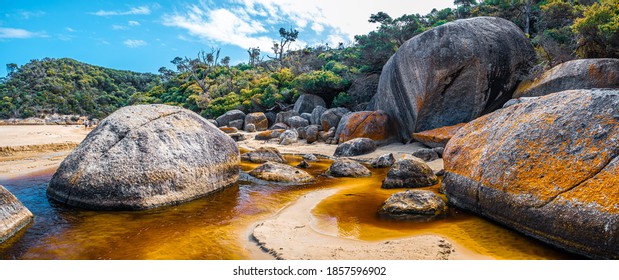 Panorama of brown water of Tidal River and huge boulders. Wilsons Promontory, Victoria, Austrlaia - Shutterstock ID 1857596902