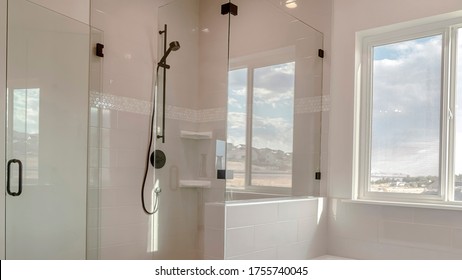 Panorama Built in bathtub with black faucet and shower stall with half glass enclosure - Shutterstock ID 1755740045
