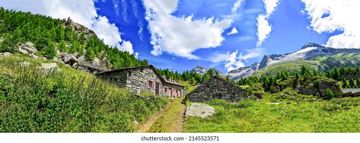 Panorama of cabin in mountains. Mountain scene with cabin