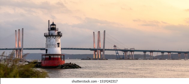 Panorama Of A Caisson (sparkplug) Style Lighthouse Under Soft Golden Light With A Bridge In The Background. Tarrytown Light On The Hudson River In New York. 