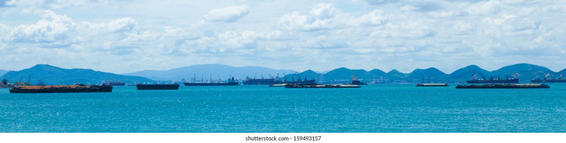 panorama cargo ship.Cargo ship moored in the sea. Waiting for the check from the docks along the shore.