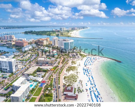 Panorama of city Clearwater Beach FL. Summer vacations in Florida. Beautiful View on Hotels and Resorts on Island. Blue-Turquoise of Ocean water. American Coast or shore Gulf of Mexico. Sunny day.