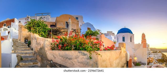 Panorama of the city of Oia on the island of Santorini, Greece. Picturesque houses and churches with blue domes over the caldera, Aegean Sea