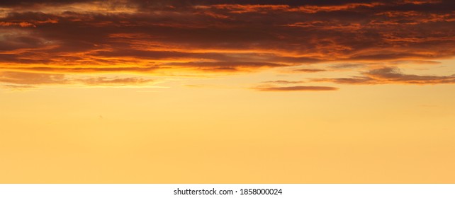 panorama of cloudscape at sunset with red clouds and copyspace