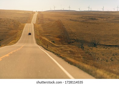 Panorama Of Colorado Eastern Plains With Freeway And Wind Mills.