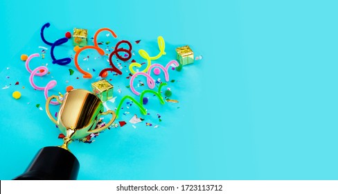 Panorama concept. Celebrating the success that has happened, Gold trophy placed on a blue background. There are gift boxes and colorful ribbons. Free space to put text into advertising media.