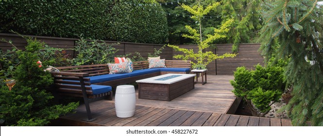 Panorama of a contemporary outdoor conversation inspired by oriental design.